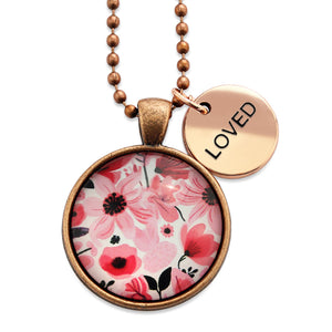 Pink floral print circle pendant vintage red  ball chain necklace with rose gold 'loved' word charm. Fundraising product for the National Breast Cancer Foundation. 