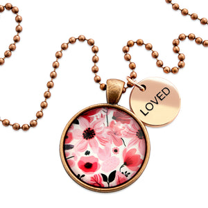 Pink floral print circle pendant vintage red  ball chain necklace with rose gold 'loved' word charm. Fundraising product for the National Breast Cancer Foundation. 