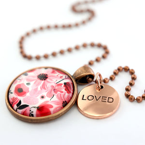 Pink floral print circle pendant vintage red  ball chain necklace with rose gold 'loved' word charm. Fundraising product for the National Breast Cancer Foundation. 