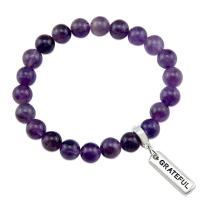 Purple amethyst stone bead bracelet with charm featuring meaningful and inspiring words with silver clip. 