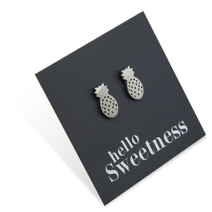 silver hypoallergenic stainless steel pineapple studs on foil hello sweetness