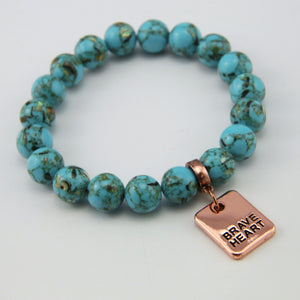 Teal coloured stone bracelet with word charm and rose gold clip. 