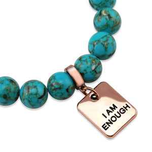 Teal coloured stone bead bracelet with rose gold meaningful word charm. 