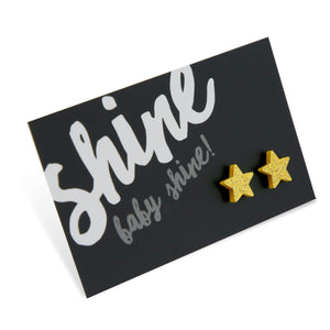 Gold glitter star acrylic earring stud on shine baby shine card. 