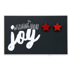 Red glitter star acrylic earring stud on wishing you joy card.