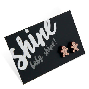 Dark briwn rose gold glitter shimmer gingerbread earring studs on shine baby shine card. 