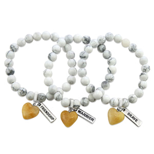 White howlite marble stone bead bracelet with charms featuring yellow adventurine heart.