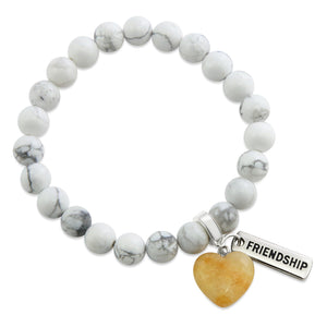 White howlite marble stone bead bracelet with charms featuring yellow adventurine heart.