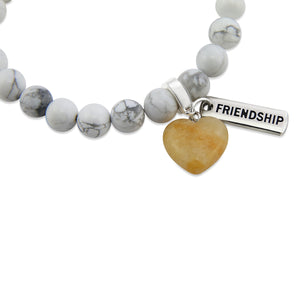 White howlite marble stone bead bracelet with charms featuring yellow adventurine heart.