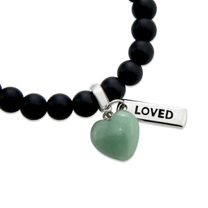 Matt black onyx stone beaded bracelet with feature green adventurine stone heart charm and inspiring word charms in silver.