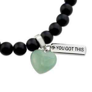 Matt black onyx stone beaded bracelet with feature green adventurine stone heart charm and inspiring word charms in silver.