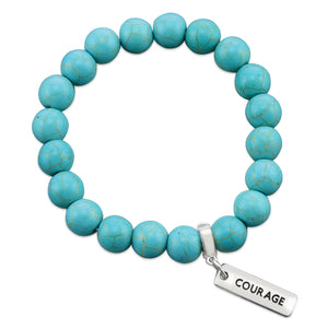 Turquoise stone bead bracelet with silver charms with meaningful words. 