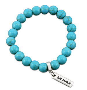 Turquoise stone bead bracelet with silver charms with meaningful words. 