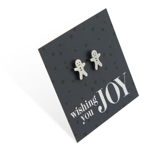 Silver stainless steel gingerbread cookies on foil wishing you joy card.